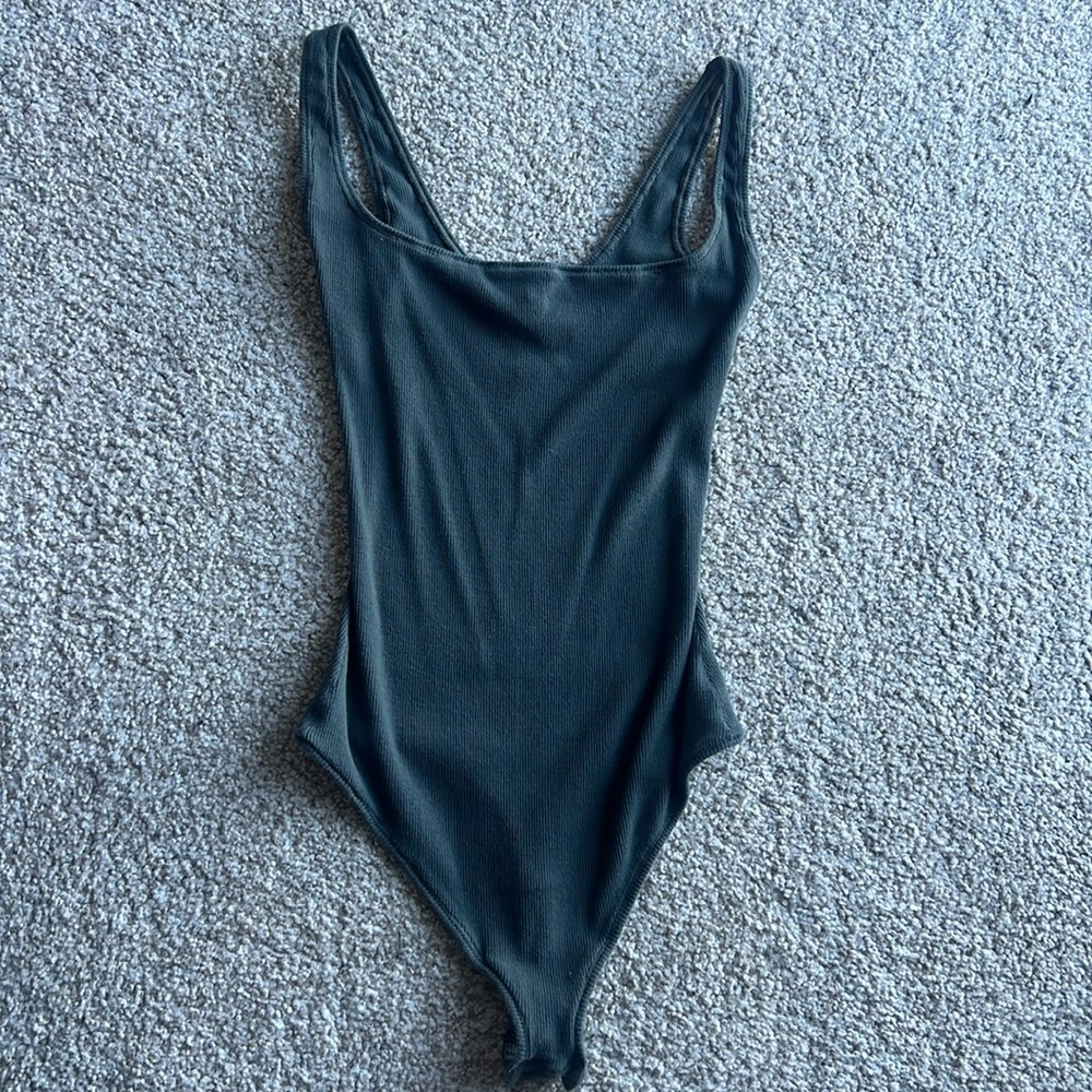 Skims square neck thong body suit.